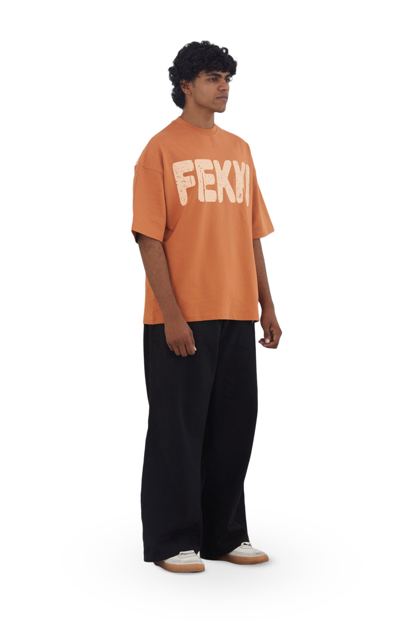 The Famous Tee by Fekki is a vibrant orange t-shirt that proudly proclaims, "Almost Famous." This playful and eye-catching design speaks to those who embrace their unique journey and celebrate individuality. Made from 100% cotton, this tee offers exceptional comfort and durability, making it perfect for casual outings or making a bold statement. The bright orange color adds a lively pop to any outfit, ensuring you stand out from the crowd. As a limited-edition piece, the Famous Tee is a must-have for fashio