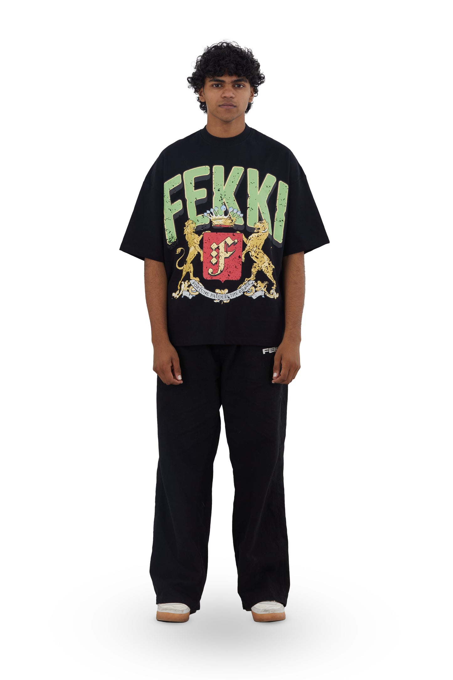 The Legacy Tee by Fekki is a striking black t-shirt featuring an emblem that embodies strength and identity. Crafted from 100% cotton, this tee offers a perfect balance of style and comfort, making it ideal for individuals who appreciate subtle yet impactful fashion. The Legacy Tee is designed for those who value limited-edition pieces that reflect a sense of belonging and pride. With its sleek silhouette and unique emblem, it seamlessly fits into any wardrobe. Enjoy free shipping across India