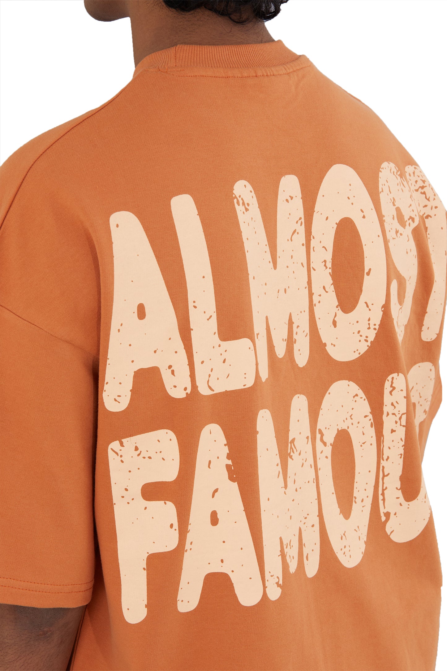 The Famous Tee by Fekki is a vibrant orange t-shirt that proudly proclaims, "Almost Famous." This playful and eye-catching design speaks to those who embrace their unique journey and celebrate individuality. Made from 100% cotton, this tee offers exceptional comfort and durability, making it perfect for casual outings or making a bold statement. The bright orange color adds a lively pop to any outfit, ensuring you stand out from the crowd. As a limited-edition piece, the Famous Tee is a must-have for fashio