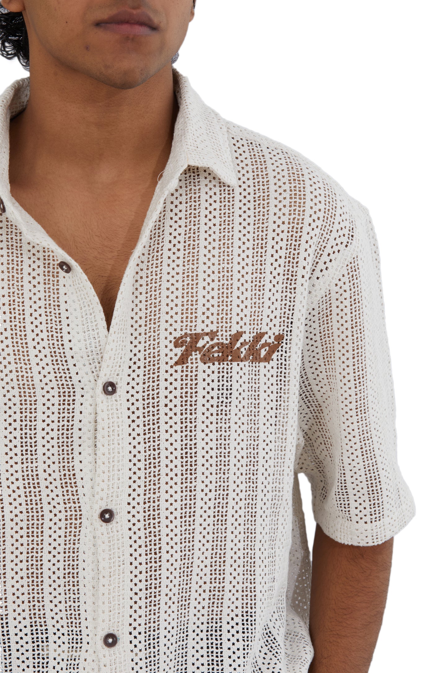 The Cream Crochet Shirt by Fekki combines timeless elegance with a contemporary edge. This versatile cream-colored (or white) crochet shirt offers a textured, handcrafted design that stands out in both casual and upscale settings. Made from 100% cotton, it’s lightweight, breathable, and machine washable, delivering both style and comfort. As a limited-edition piece, the Cream Crochet Shirt is ideal for fashion-conscious individuals looking for something unique and sophisticated. Enjoy free shipping across I